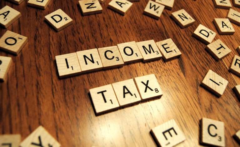 income tax written on mini cubes