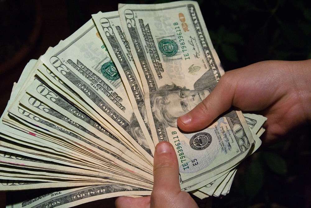 US dollar in man hand 