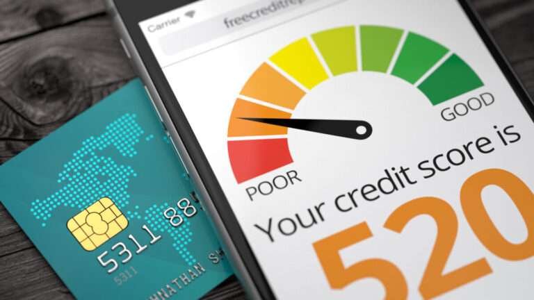 a credit score chart on mobile with credit card aside