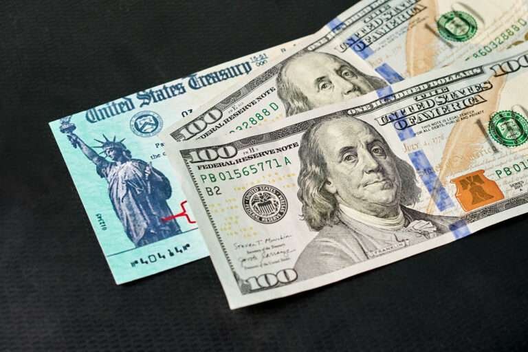 dollars bills on black table